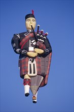 ENGLAND, Bristol, "Scotsman playing bagpipes hot air balloon,"