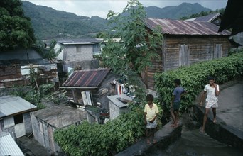 ST LUCIA, Soufriere, "Wood and breeze block housing with corrugated tin rooves, hanging washing and