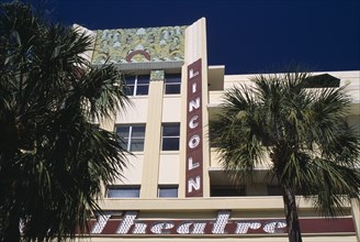 USA, Florida, Miami, South Beach. Lincoln Avenue. The Lincoln Theatre exterior with palm trees