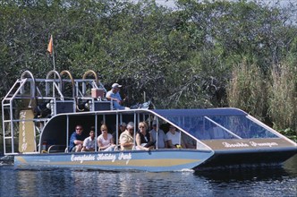 USA, Florida, Fort Lauderdale, Tourists Air boating in the Everglades National Park