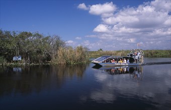 USA, Florida, Fort Lauderdale, Tourists Air boating in the Everglades National Park