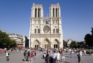 FRANCE, Ile de France, Paris, Tourists in the Place du Parvis Notre Dame in front of the west front