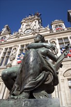 FRANCE, Ile de France, Paris, One of several female bronze statues in front of the Hotel de Ville