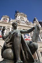 FRANCE, Ile de France, Paris, One of several female bronze statues in front of the Hotel de Ville