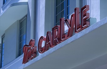 USA, Florida, Miami, South Beach. Ocean Drive. The Carlyle Hotel. Detail of 1930’s Art Deco sign.