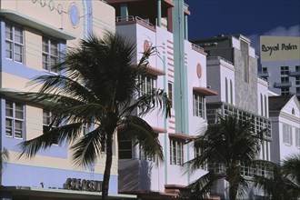 USA, Florida, Miami, South Beach. Ocean Drive. Art Deco hotel facades and palm trees seen in early