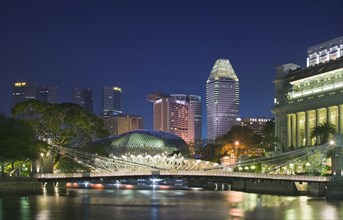 SINGAPORE, Esplanade, Night time view along the Singapore River towards Esplanade. Theatres on the