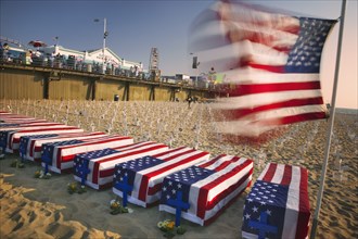 USA, California, Santa Monica, A graphic protest against the war in Iraq beneath Santa Monica Pier.