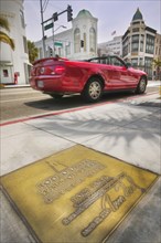 USA, California, Los Angeles, Beverly Hills. A plaque on the Rodeo Drive Walk of Style.