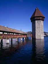 SWITZERLAND, Lucerne Central, Lucerne, Kappelbrucke flower decked covered bridge spanning across