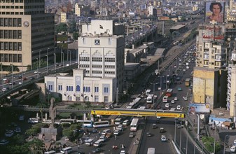 EGYPT, Cairo Area, Cairo, Elevated view over city buildings and busy roads with traffic