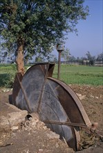 EGYPT, Agriculture , A disused water pump with fields behind