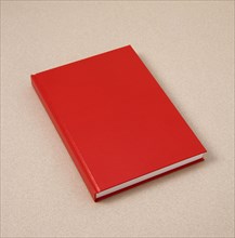 EDUCATION, Reading, Writing, Red hard back notebook or diary.