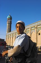 AFGHANISTAN, Herat, Boy outside the Friday Mosque or Masjet-eJam Originally laid out on the site of