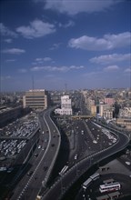 EGYPT, Cairo Area, Cairo, Elevated view over busy road network and tall city buildings