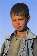 AFGHANISTAN, Bamiyan Province, Bamiyan, Portrait of a young boy