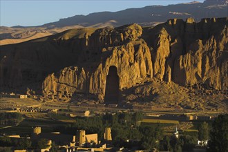 AFGHANISTAN, Bamiyan Province, Bamiyan, View of Bamiyan valley and village showing cliffs with