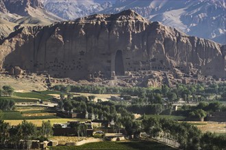 AFGHANISTAN, Bamiyan Province, Bamiyan, View of Bamiyan valley and village showing cliffs with