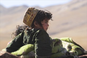 AFGHANISTAN, Desert, "Kuchie nomad camel train, between Chakhcharan and Jam, Children on top of
