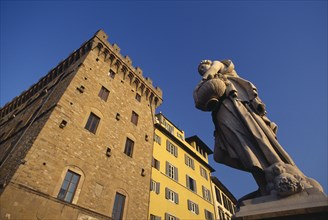 ITALY, Tuscany, Florence, Angled view of building facades and statue by the Ponte Santa Trinita.