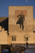 MONGOLIA, Hovd Province, Architecture, Wall painting depicting Lenin on building in Hovd sum centre