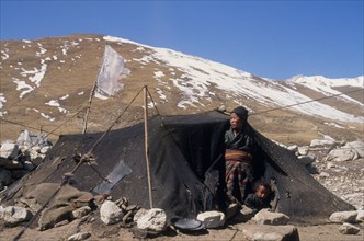 NEPAL, Mustang, Nomads, "Tibetan nomad encampment on the high plateau, woman and child looking out