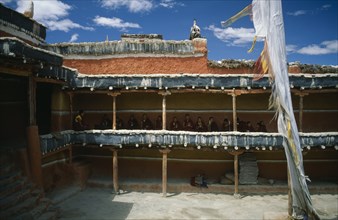 NEPAL, Mustang, Namgyal, Tibetan Buddhist monks awaiting the arrival of the King from upper balcony