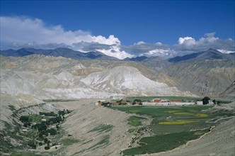 NEPAL, Mustang, Lo Manthang, "Distant view of Mustang’s capital Lo Manthang surrounded by green,