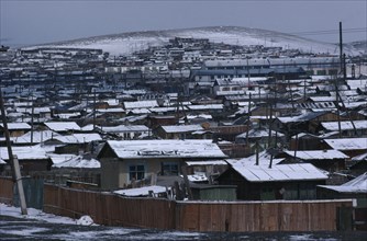MONGOLIA, Ulan Bator, Snow covered rooftops of housing in city suburbs in winter.