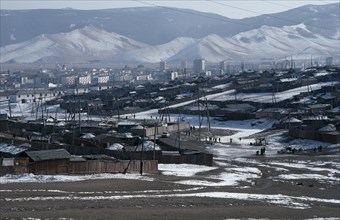 MONGOLIA, Ulan Bator, Traditional housing surrounding Soviet built city centre in winter snow with