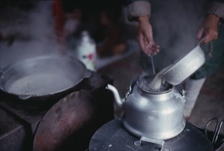 MONGOLIA, Food and Drink, Cropped shot of person making tea.
