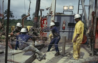 NIGERIA, Rivers State, Bonny, Workers on off-shore oil rig.