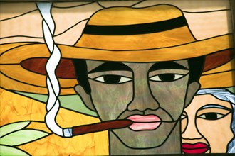 CUBA, Trinidad, Colourful stained glass window of man smoking a cigar