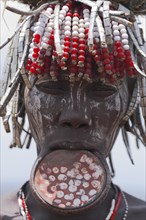 ETHIOPIA, South Omo Valley, Mursi Tribe, Woman with lip plate.