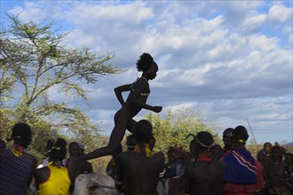 ETHIOPIA, Lower Omo Valley, Turmi, "Hama Jumping of the Bulls intiation ceremony, the initiate runs