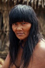 BRAZIL, Mato Grosso, Indigenous Park of the Xingu, Head and shoulders portrait of young  Panara