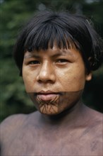 COLOMBIA, Choco, Embera Indigenous People, Portrait of young Embera man named Rio Verde on rio