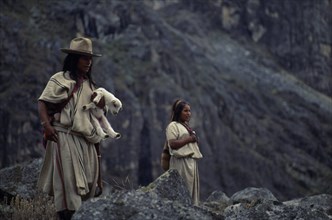 COLOMBIA, Sierra Nevada de Santa Marta, Ika, Ika shepherd in traditional wool&cotton manta cloak
