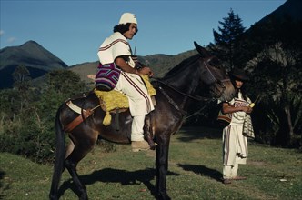 COLOMBIA, Sierra Nevada de Santa Marta, Ika, Ika leader Vicente Villafana on mule with another man