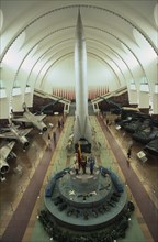 CHINA, Beijing, "Interior hall of the Chinese Military Museum with visitors looking at display of