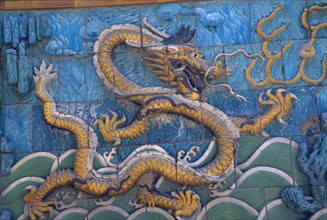 CHINA, Beijing, Detail of Nine Dragon Screen in the Forbidden City constructed in 1773.