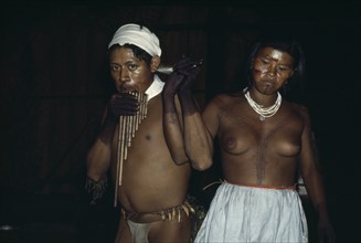 COLOMBIA, North West Amazon, Tukano Indigenous People, Group of young Barasana dancing a panpipe
