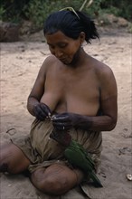 COLOMBIA, North West Amazon, Tukano Indigenous People, Barasana woman with dark purple we leaf dye