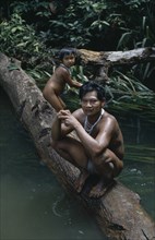 COLOMBIA, North West Amazon, Tukano Indigenous People, Barasana father Pacico and his son stand on