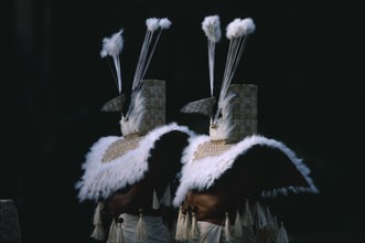 PACIFIC ISLANDS, French Polynesia, Tahiti, Two figures dressed in costume with woven mask and cape