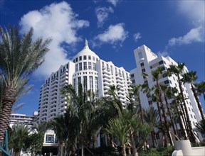 USA, Florida, Miami, South Beach. Loews Hotel exterior with palm trees and blue sky