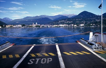 ITALY, Piedmont, Pallanza, View across Lake Maggiore towards shoreline and Pallanza from the ferry