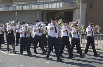 ENGLAND, West Sussex, Worthing, The Salvation Army Band marching along seafront in the summer.