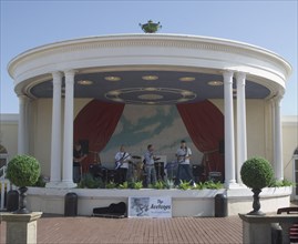 ENGLAND, West Sussex, Worthing, A band playing in the Lido bandstand
