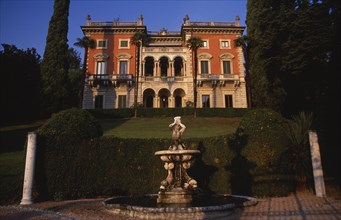 ITALY, Lombardy, Lake Como, "Private villa and formal gardens near Tremezzo, stone fountain in